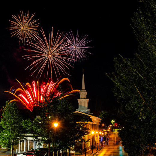 4th of july fireworks over a downtown church
