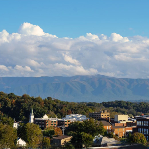 small town with a giant mountain behind it