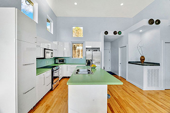 modern white kitchen with green apple martini countertops