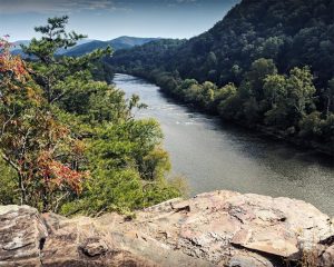 standing on paint rock overlooking French Broad river